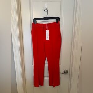 Veronica Beard Vibrant orange pants.